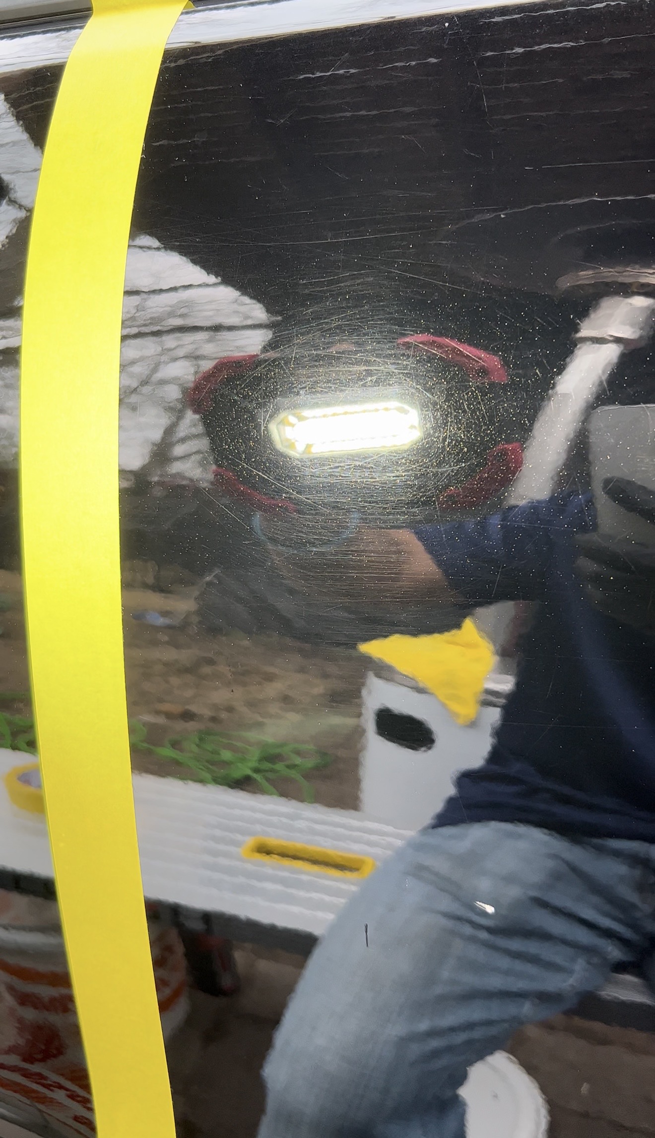 Black paint with heavy swirl marks and scratches before correction