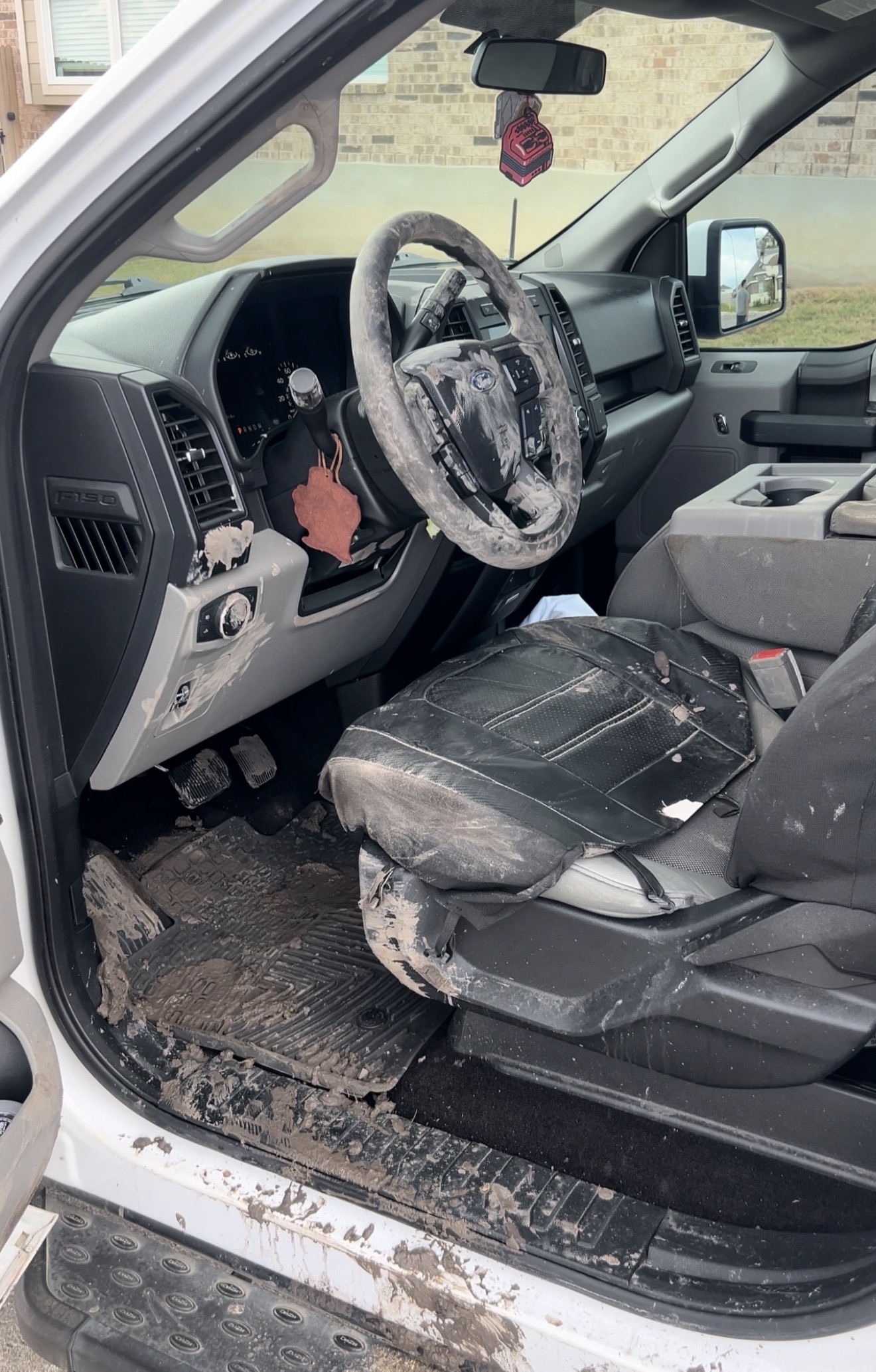 Ford F-150 interior before deep clean — mud and buildup throughout cabin Converse TX