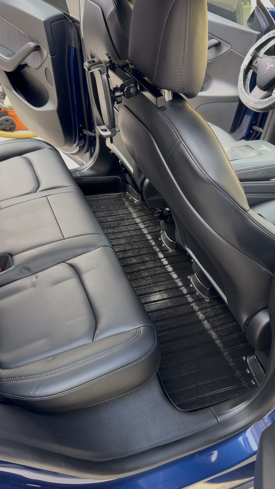 Tesla Model Y rear floor after interior detailing by Lizardi Mobile Detailing